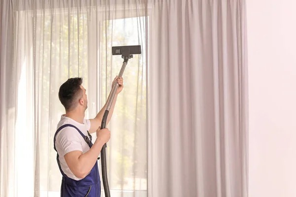 imgi_96_depositphotos_196808458-stock-photo-male-worker-removing-dust-curtains